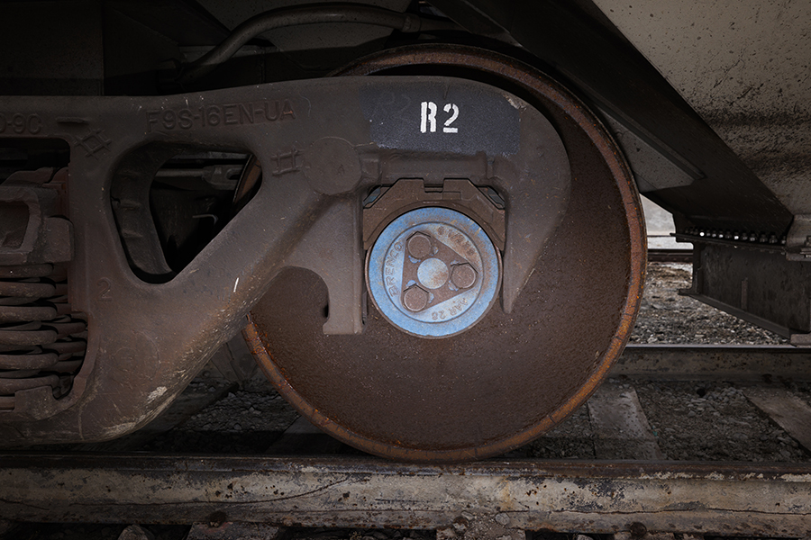 A closer look at the roller bearings in one of the wheels on a railroad railcar.