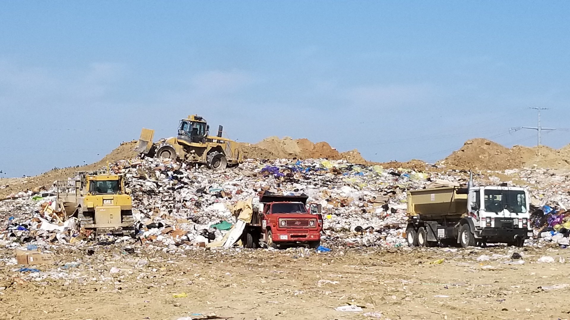 Machinery working in a landfill.