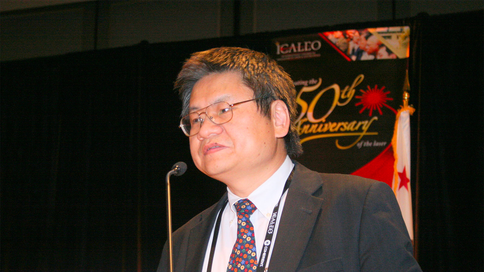 Dr. Yongfeng Lu speaking to an audience.
