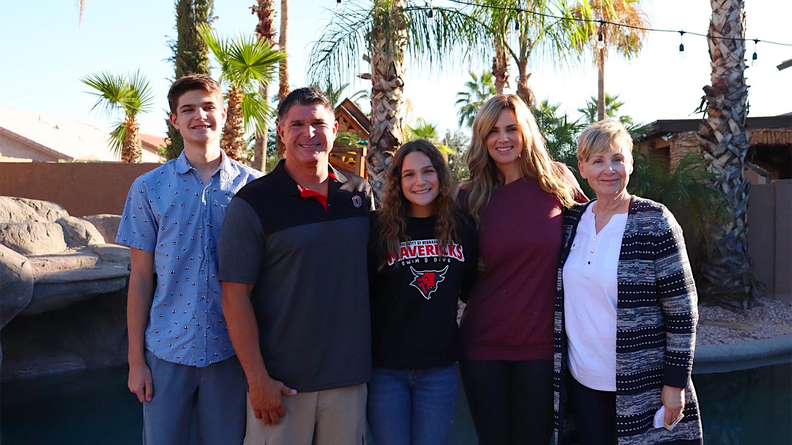 A picture of the Khalil family celebrating Sadie's commitment to become a Division 1 Student Athlete (swimming).