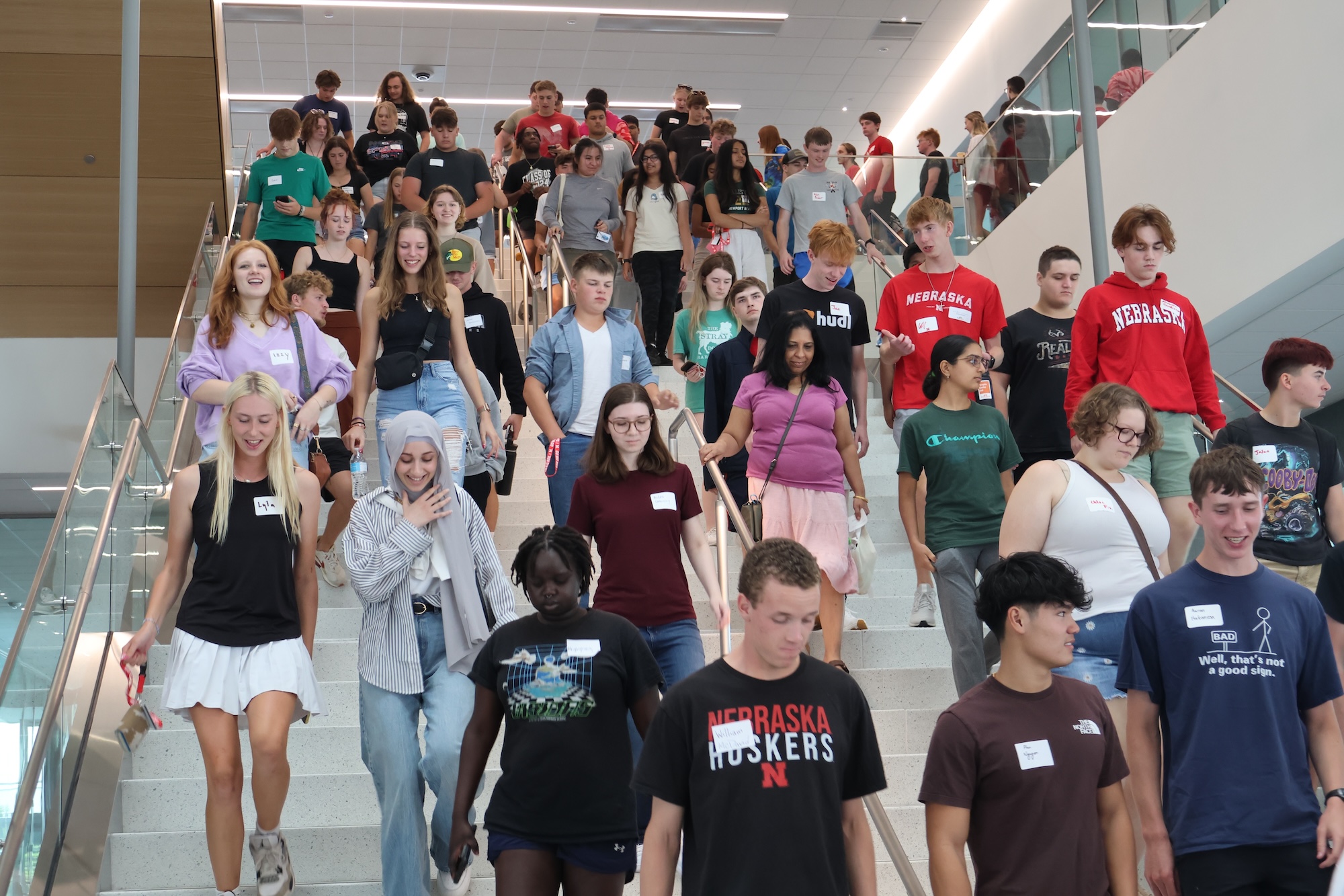 Crowd of new students walking down a large stariway