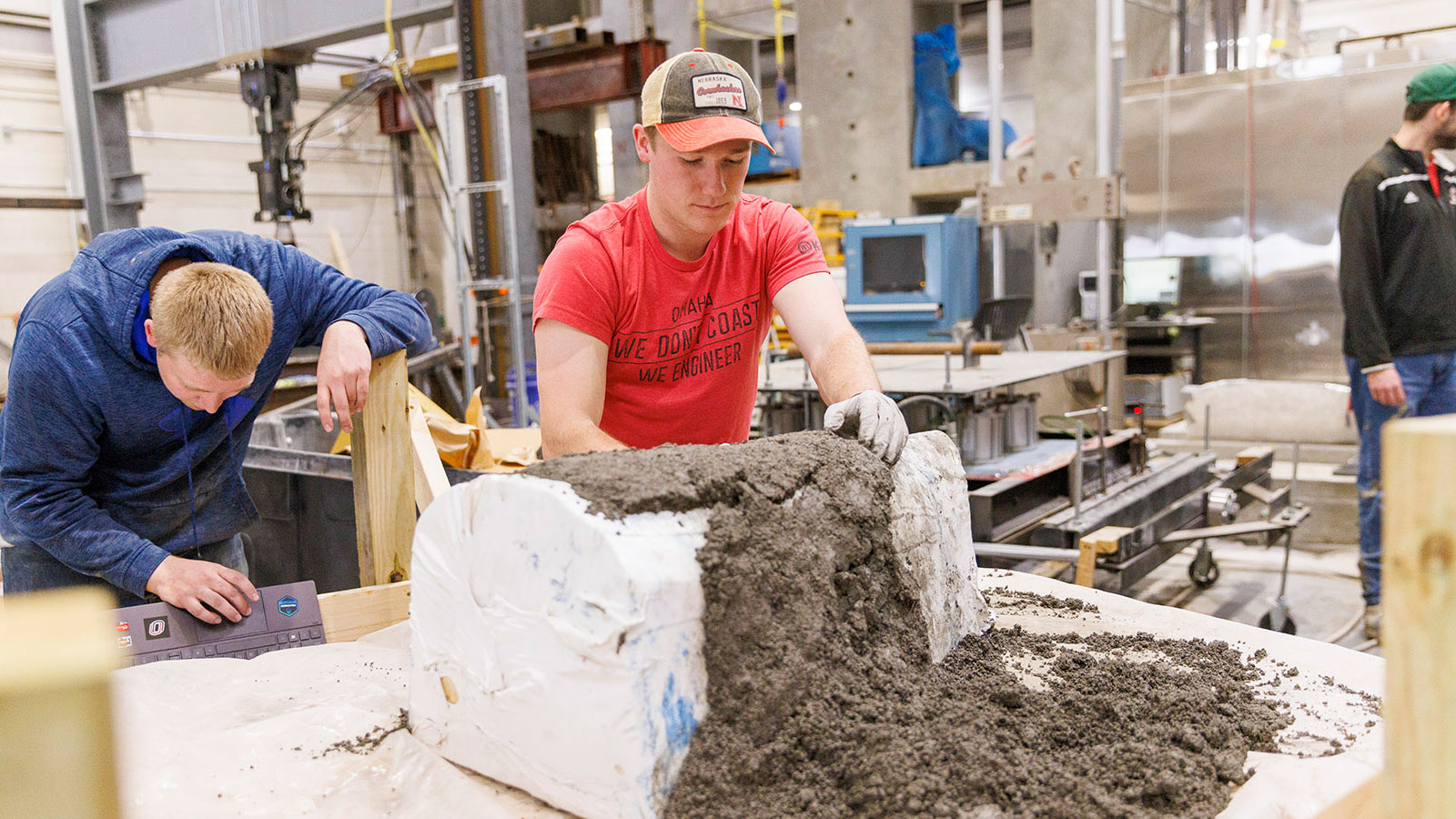 Construction Engineering students work with cement.