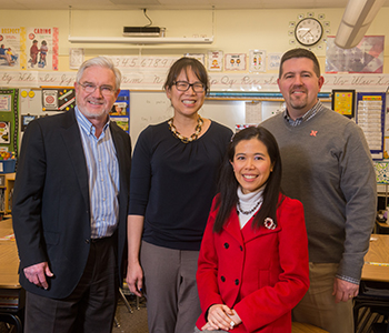 Three UNL Architectural Engineering faculty – (from left) professors Clarence Waters and Lily Wang and assistant professor Josephine Lau – are teaming with Jim Bovaird (right), associate professor of educational psychology, on a four-year EPA grant to study indoor environmental factors and their effects on the scholastic achievement of students from kindergarten through 12th grade. (Photo by Greg Nathan, University Communications)