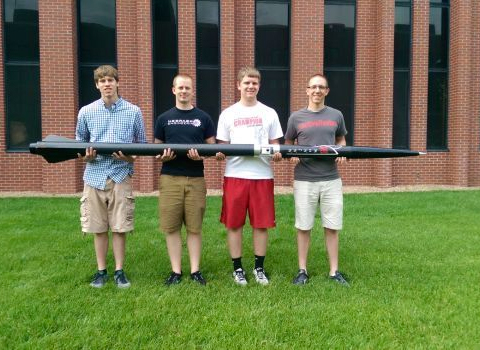 Members of a University of Nebraska-Lincoln aerospace team hope to fire their rocket, called Munnin, 25,000 feet into the air. They are, from left: Alex Buford, Michael Reyes, Brad Christensen and Bryan Kubitschek.