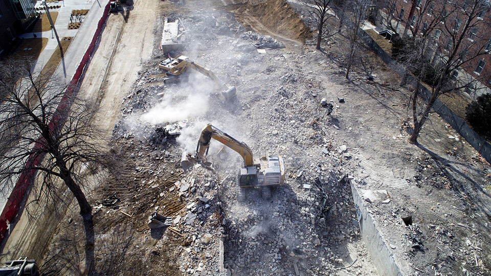 Crews remove concrete and debris from the demolition site of Cather and Pound Halls in February 2018. Nebraska researchers are working to improve recycled concrete for reuse in construction. (University Communication and Marketing)