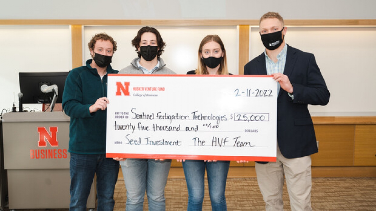 Husker Venture Fund awarded its first investment of $25,000 to Jackson Stansell, (second from left) a biological systems engineering doctoral student. Also pictured are HVF students and managing directors Keith Nordling (left), Emily Kist (second from right), and Adam Folsom.