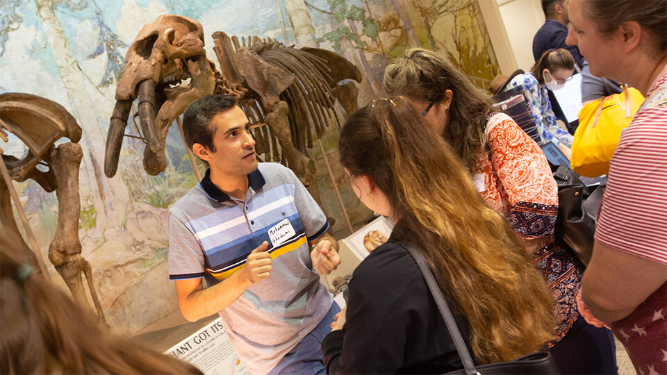Mohammad Ghashami (left), assistant professor of mechanical and materials engineering, speaks with LPS teachers at Morrill Hall. (University Communication and Marketing)