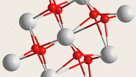 An atomic-level rendering of the material known as hafnium oxide, which consists of one hafnium atom (white) for every two oxygen (red). Bucking years of conventional wisdom, Husker researchers have shown that the material’s most technologically appealing property can emerge from unexpected conditions. (Adapted from figure in Nature Materials / Springer Nature)