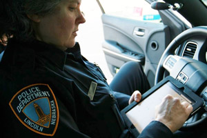 LPD Officer Mary Lingelbach uses CrimeView NEARme technology developed by UNL computer engineers.