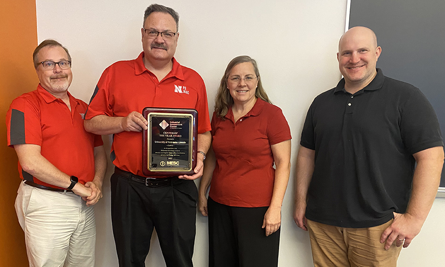 The Nebraska Industrial Assessment Center (NIAC) faculty directors (from left) Bruce Dvorak, Robert Williams and Karen Selling and technical advisor Sam Ghormley - hold the plaque designating the NIAC as the U.S. Department of Energy's 2023 IAC of the year.