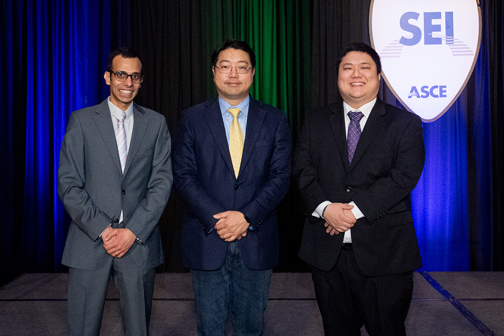Chungwook Sim (center), associate professor of civil and environmental engineering, is joined by alumni Micheal Assad (left) from Kiewit Corporation and David Gee from e.Construct in accepting the ASCE 2022 T.Y. Lin Award.