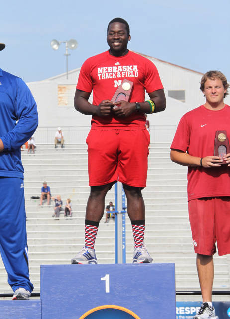 Chad Wright stands with his earned men's discus national championship.