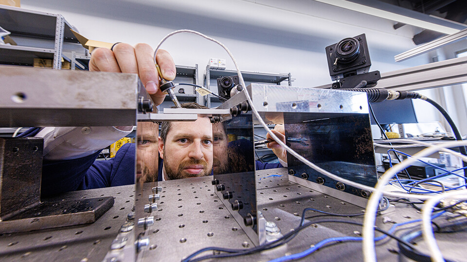 Keegan Moore, assistant professor of mechanical and materials engineering, will use high speed cameras to capture the interface contact conditions — the surfaces the bolts hold together. (Craig Chandler / University Communication and Marketing)