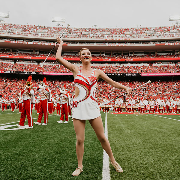Kimberly Law, a freshman in chemical engineering from La Quinta, California, is one of two featured twirlers in the Cornhusker Marching Band. (Photo by Justin Mohling)