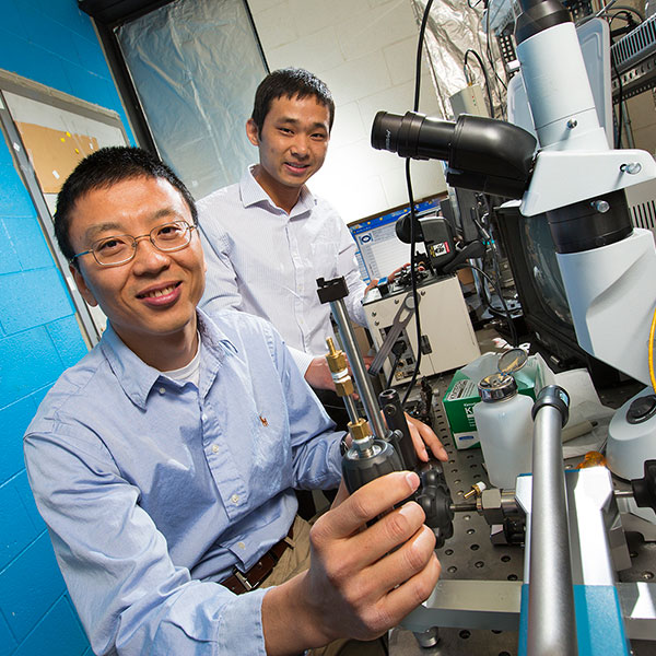 Ming Han (left), associate professor of electrical and computer engineering, and Guigen Liu, a postdoctoral researcher in electrical and computer engineering,