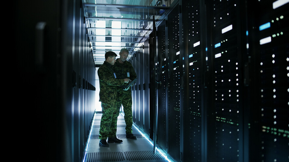 Military members work in an open server rack. The university has earned a $25 million contract with the National Nuclear Security Administration. The work will support strategic deterrence and nuclear threat reduction efforts. (Shutterstock)