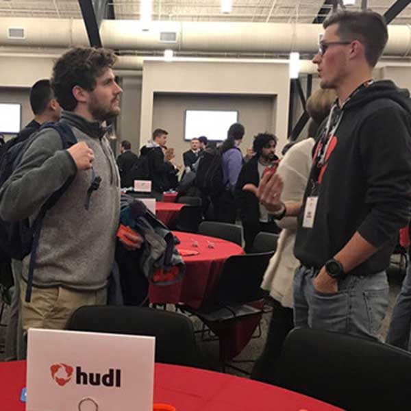 A Nebraska student talks with a Hudl representative during the Reverse Pitch event in January. The job exploration series continues through April.