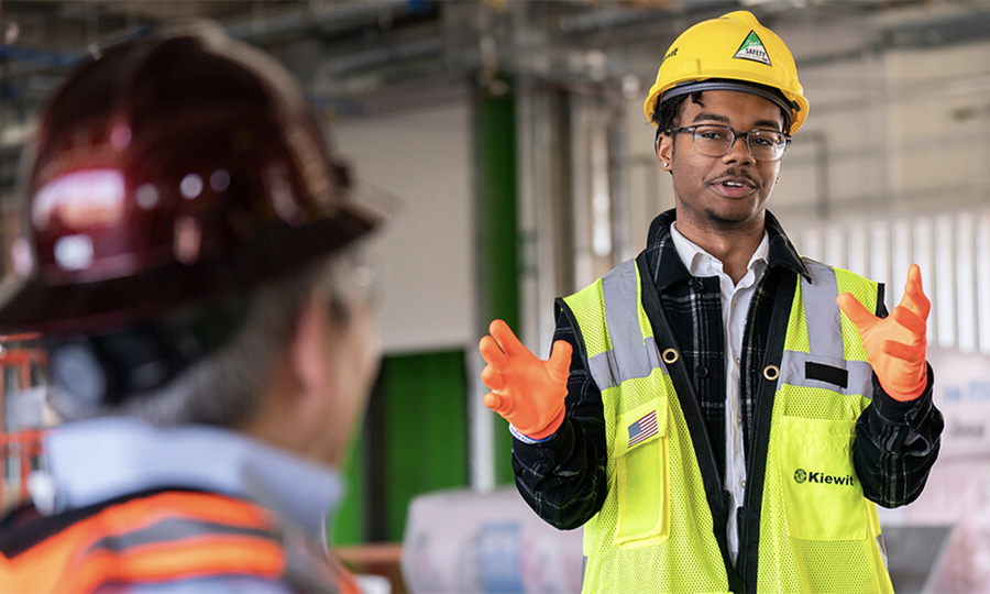 Nebraska's Andre Tharp III gestures as he talks with Dean Lance C. Pérez during a recent tour of Kiewit Hall construction. (University Communication and Marketing)