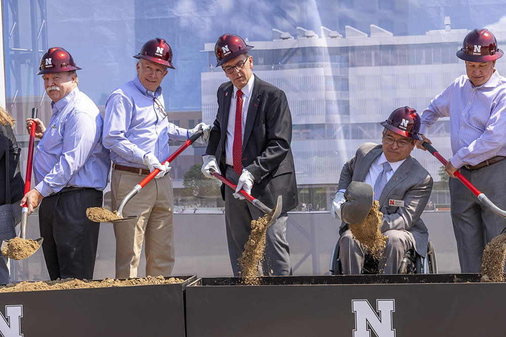 Dean Lance C. Pérez (second from right) joins with members of the College of Engineering Advisory Board and the UNL Chancellor in turning a shovelful of dirt during the groundbreaking ceremony for Kiewit Hall on Monday, June 28. (Craig Chandler / University Communication)