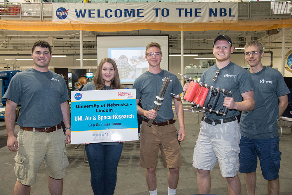 The UNL Air and Space Research team - (from left) Luke Monhollon, Claire Ashley, Nathan Borcyk, Brandon Jackson and Carl Nelson, professor of mechanical and materials engineering - designed a gap spanner boom for the NASA Micro-g NExT Challenge.