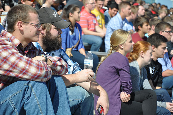 First-year UNL engineering students sit in the bleachers at Veterans Memorial Field as they listen to speakers during the annual Industry Day Tour in Norfolk on Oct. 9.