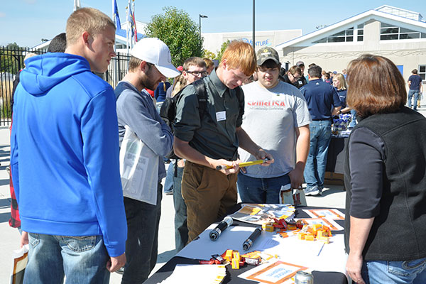 More than 500 first-year engineering students examine products and talk with engineers from Medtronic during a career fair at Veterans Memorial Field in Norfolk on Oct. 9.