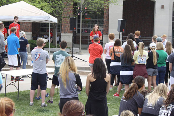 Sophomore chemical engineering major Shelby Williby talks to the 600 walkers at the Out of the Darkness Campus Walk on April 17.