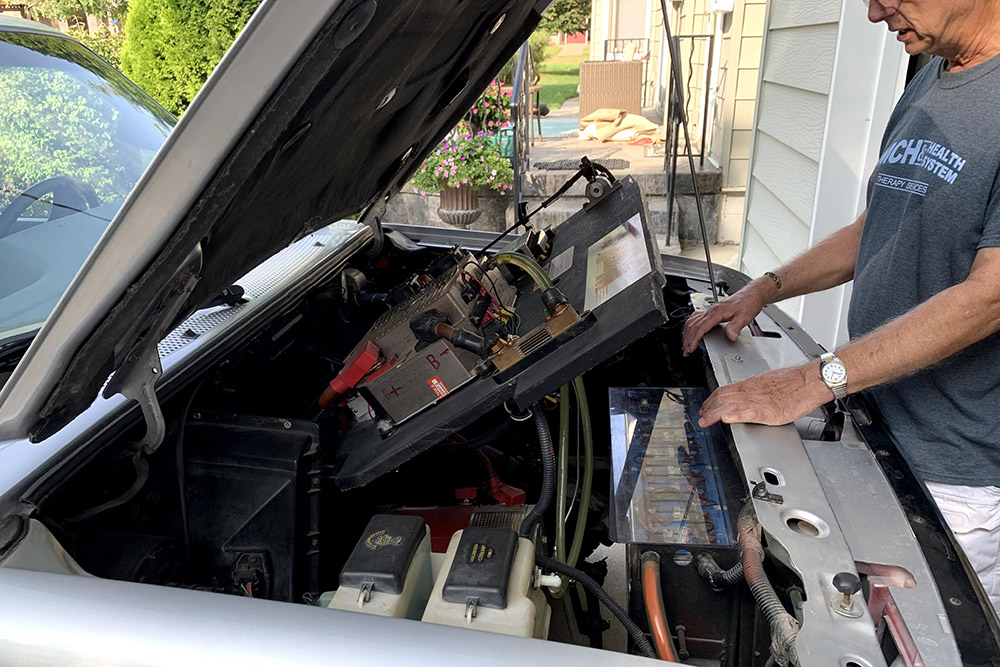 Paul Smith installed control systems under the hood of a 1994 Ford Ranger pickup while converting it to all-electrical systems.