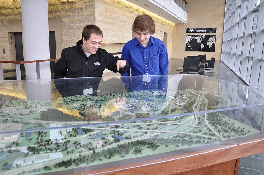 Students viewing a model of a building.