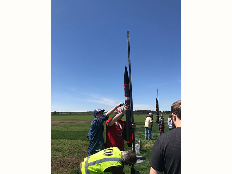 The Husker Rocketry Team setting up their rocket for take off.