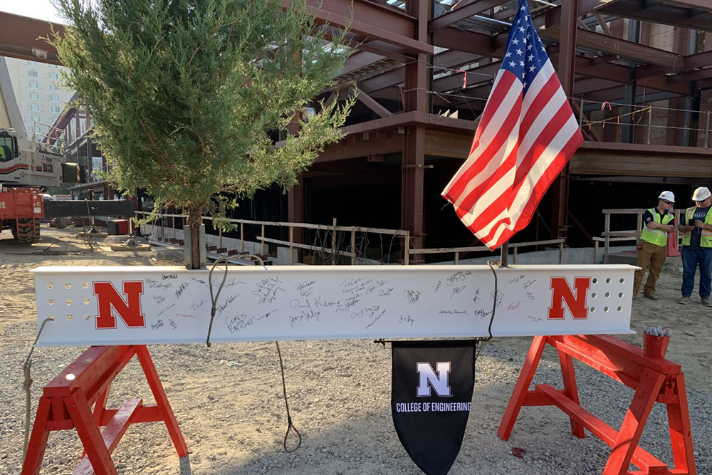 After many signatures were inscribed on the final steal beam, it was raised into place during Wednesday's Topping Out ceremony.