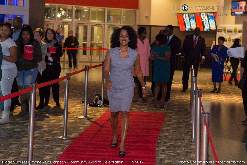 Alisa Gilmore, associate professor of practice in electrical and computer engineering, walks the red carpet at Aksarben Cinema before the Jan. 19 screening of 