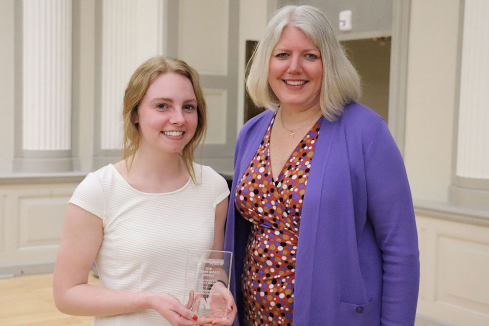 Kelly Weiler (left) of Engineering Ambassadors Network receives the Philanthropy and Service Award.