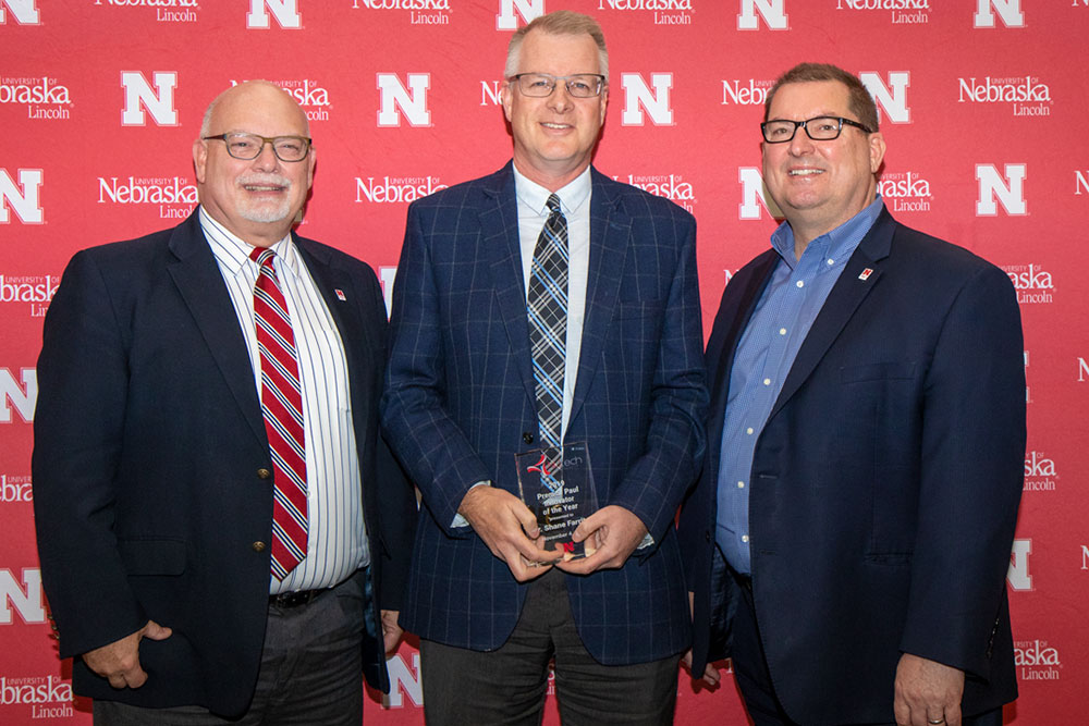Shane Farritor (center), professor of mechanical and materials engineering and chief technical officer of Virtual Incision, receives the Prem S. Paul Innovator of the Year Award from Brad Roth (left), NUtech Ventures executive director, and Bob Wilhelm, University of Nebraska-Lincoln vice chancellor of research and economic development. 