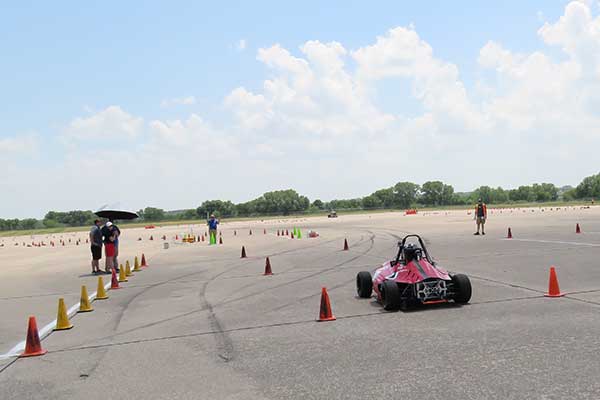 The Husker Motorsports Formula SAE car takes off to begin its autocross run on Friday at Lincoln Airpark.