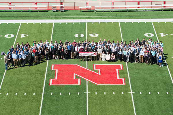 More than 200 senior design capstone students and engineering faculty gathered at midfield for a photo before the Senior Design Showcase on April 22 at Memorial Stadium.
