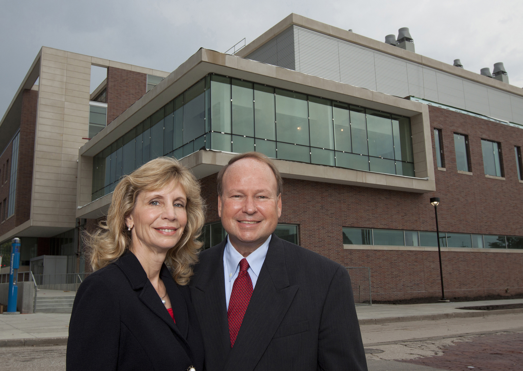 Nancy Keegan and Don Voelte, '75 CIVE, stand outside the newly dedicated Voelte-Keegan Nanoscience Research Center at UNL.