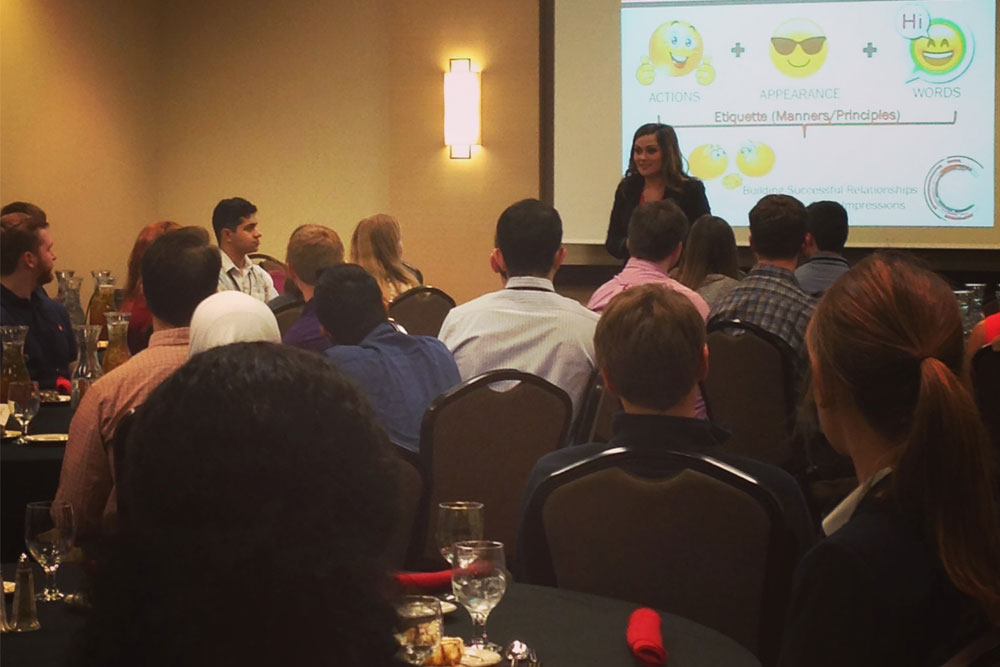 Melanie Krings, assistant director of the Executive MBA Program at UNO, discusses proper protocol for business dinners and mixers on Sunday (March 19) at the Complete Engineer Conference.