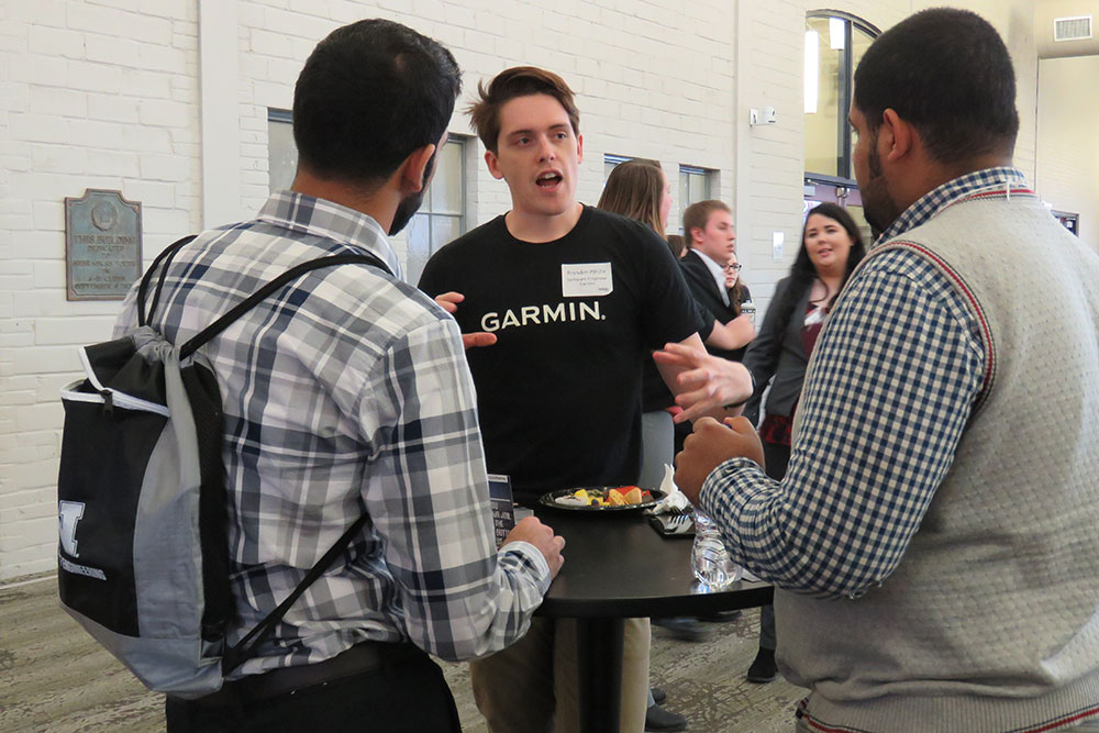 At the Complete Engineer mixer, Computer Engineering alumnus Brandon Pfeifer talks to engineering students after leading a workshop session Friday, March 2 at Nebraska Innovation Campus.