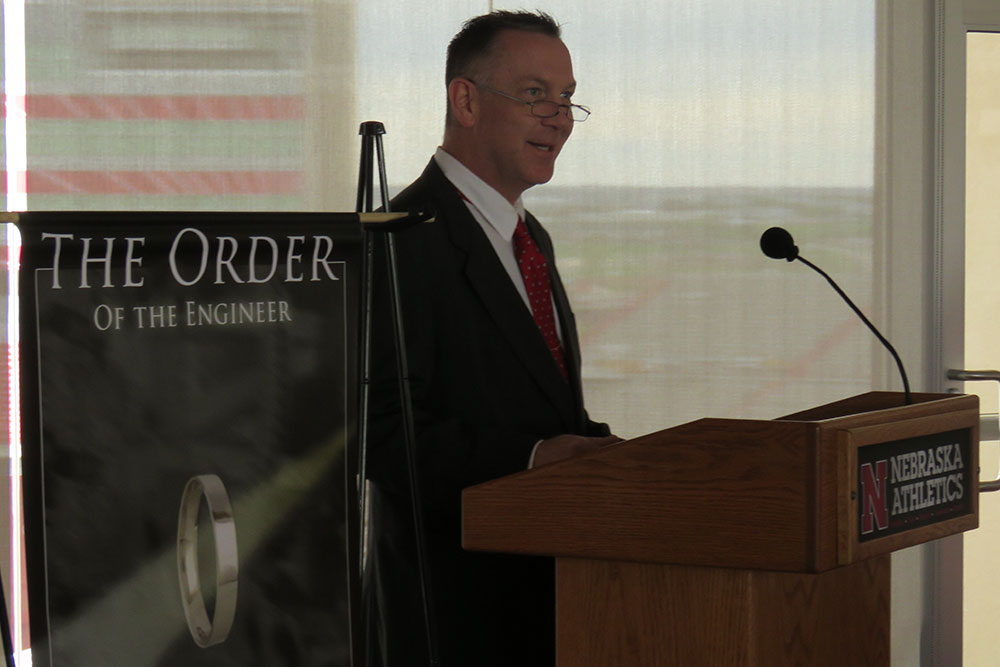 College of Engineering alumnus Douglas Ehlers delivers an address to the nine students preparing to take the oath at the Order of the Engineer ceremony after the Senior Design Showcase.