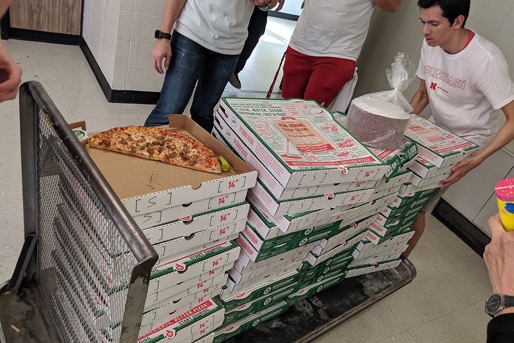 More than 90 boxes of pizza arrive in Nebraska Hall to feed the more than 200 who attended #LINKBASH.
