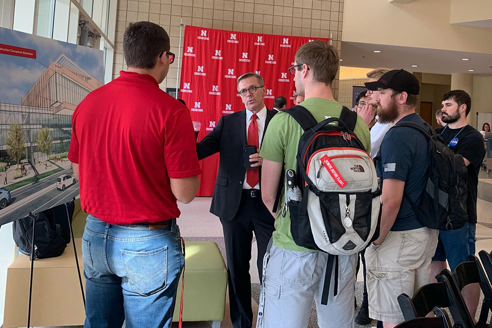 Ronnie Green, the University of Nebraska-Lincoln chancellor, talks with Nebraska Engineering students about the new Kiewit Hall after Monday's press conference in the Othmer Hall lobby.
