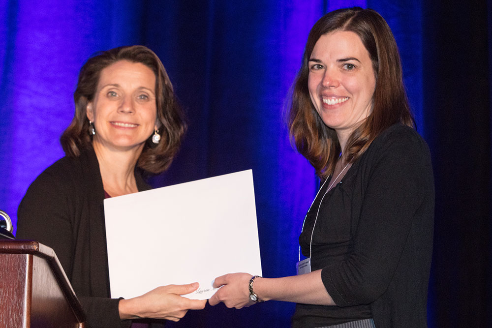 Lauren Ronsse (right), industry fellow at The Durham School of Architectural Engineering & Construction, receives the 2017 Science Writing Award for Professionals from Marcia Isakson, president of the Acoustical Society of America.