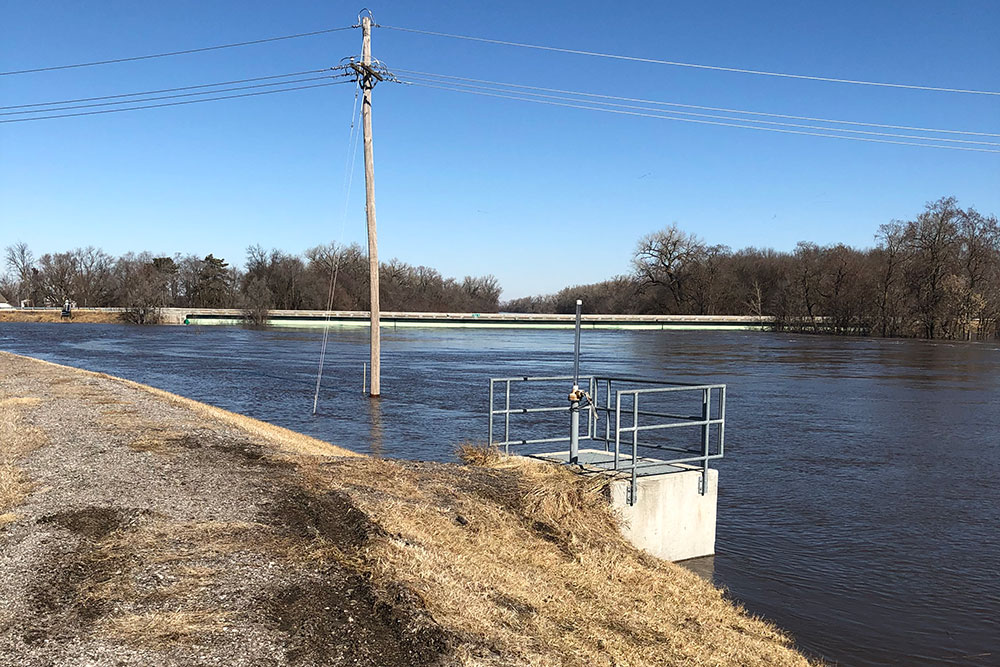 Water flows nearly touches the under side of the Maple Street bridge on the north edge of Waterloo. The river reached a record depth of more than 24 feet during the March flooding.