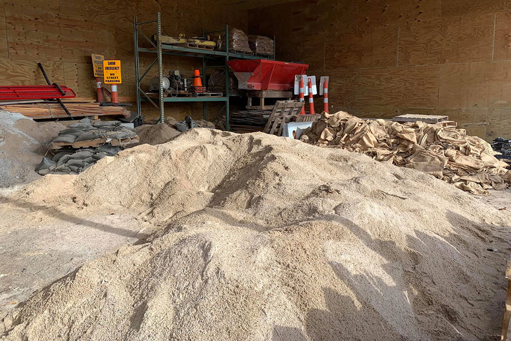 Tons of sand are piled up in a building in Waterloo, ready for volunteers to start making sandbags that would be used to bolster the levee along the Elkhorn River.