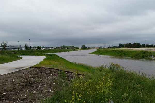 In early June, Antelope and Salt Creeks are at near flood stage where they meet north of the Devaney Sports Center.