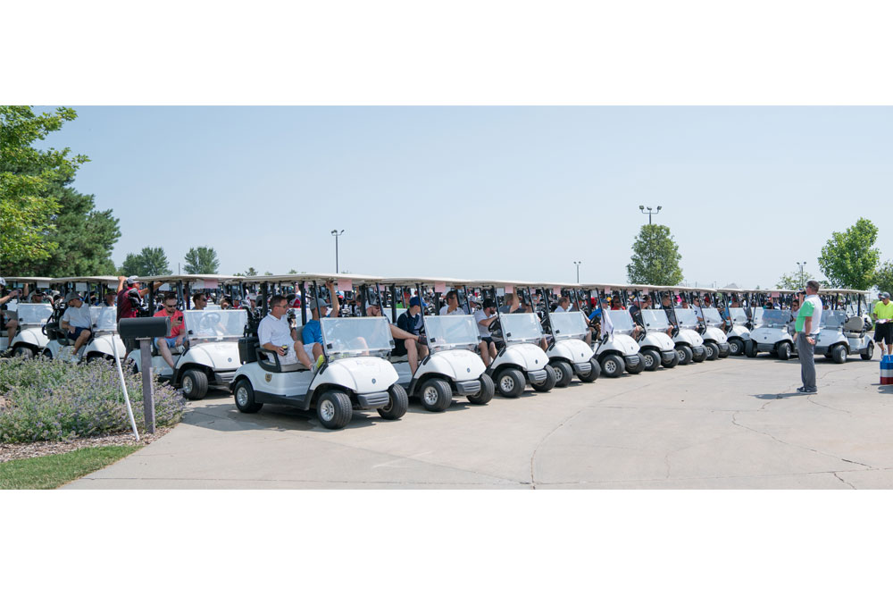 More than 60 teams with nearly 250 construction industry professionals listen to instructions as they await the signal to take their carts to their assigned tee boxes before the 15th annual Tradition of Excellence Golf Tournament on July 10 at Tiburon Golf Club in Omaha.