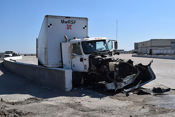 The engine of an 80,000-pound tractor-trailer was destroyed after the vehicle collided with a concrete barrier during a test April 13 at the Midwest Roadside Safety Facility.