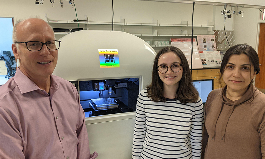 Joseph Turner (left), Robert W. Brightfelt Professor of Mechanical and Materials Engineering, and researchers Magdalene Peklo, a senior in mechanical engineering, and Faezeh Afshar-Hatam, a doctoral student in mechanical engineering, use a nano indenting machine to study how a plant cell's stomata regulates the flow of liquids and gases in response to its environment.