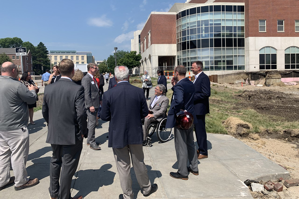 College of Engineering Dean Lance C. Pérez talks with University of Nebraska President Ted Carter and other dignitaries outside Othmer Hall during the groundbreaking ceremony for the new Kiewit Hall on Monday, June 28.